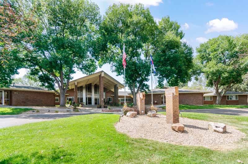 Exterior view of Westlake Lodge with landscaped area