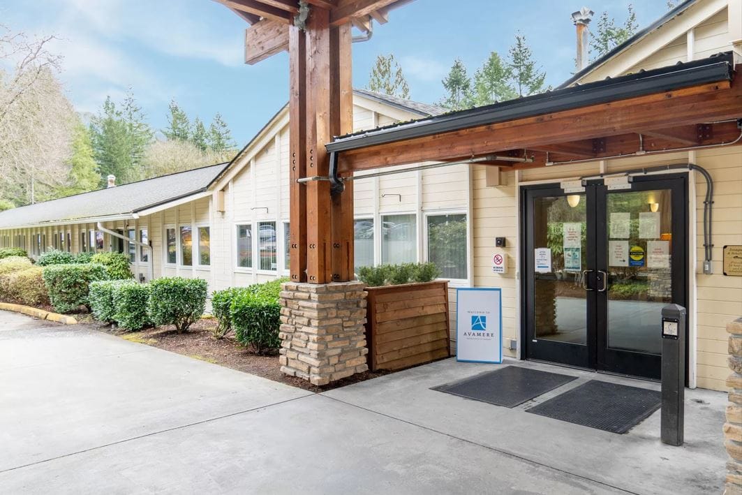 Entrance of a senior living facility with landscaping