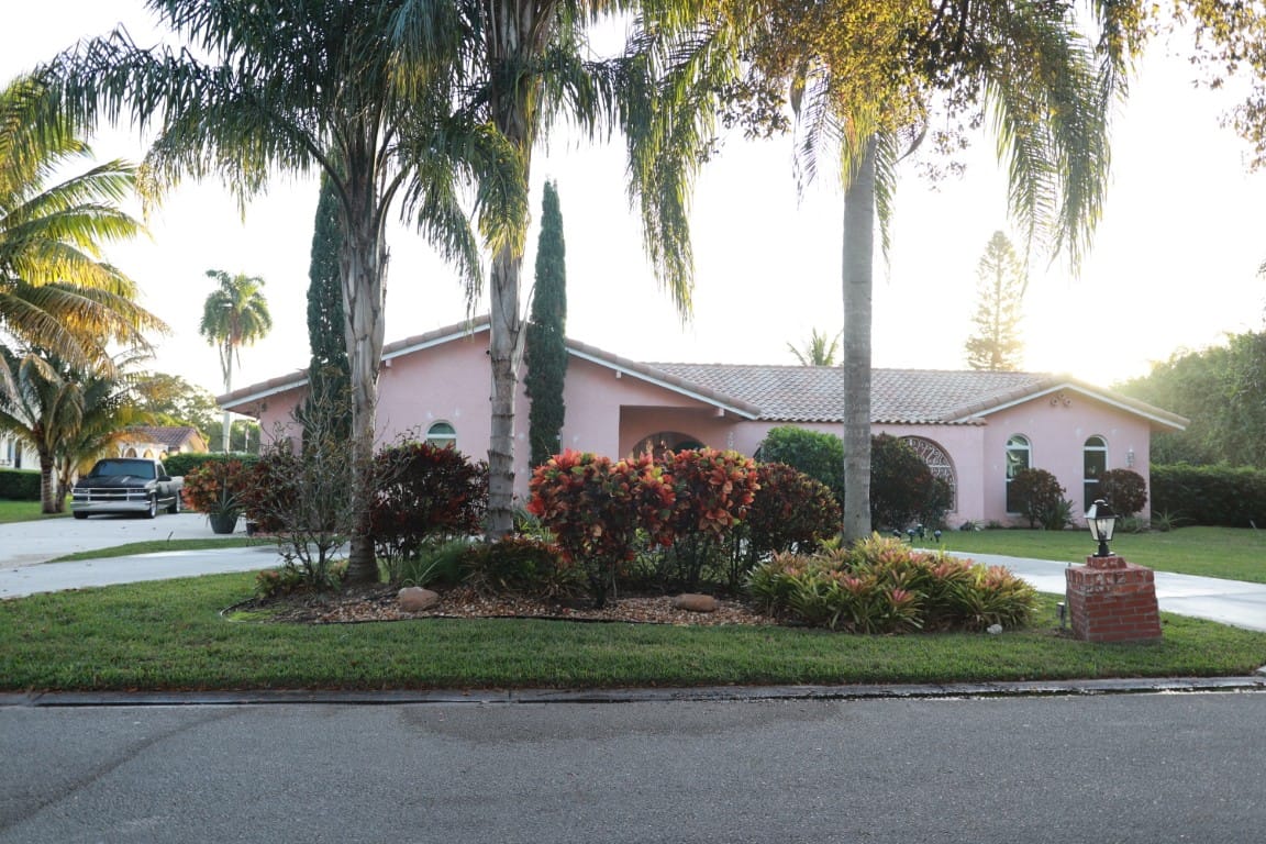 Exterior view of a senior living facility with landscaped garden