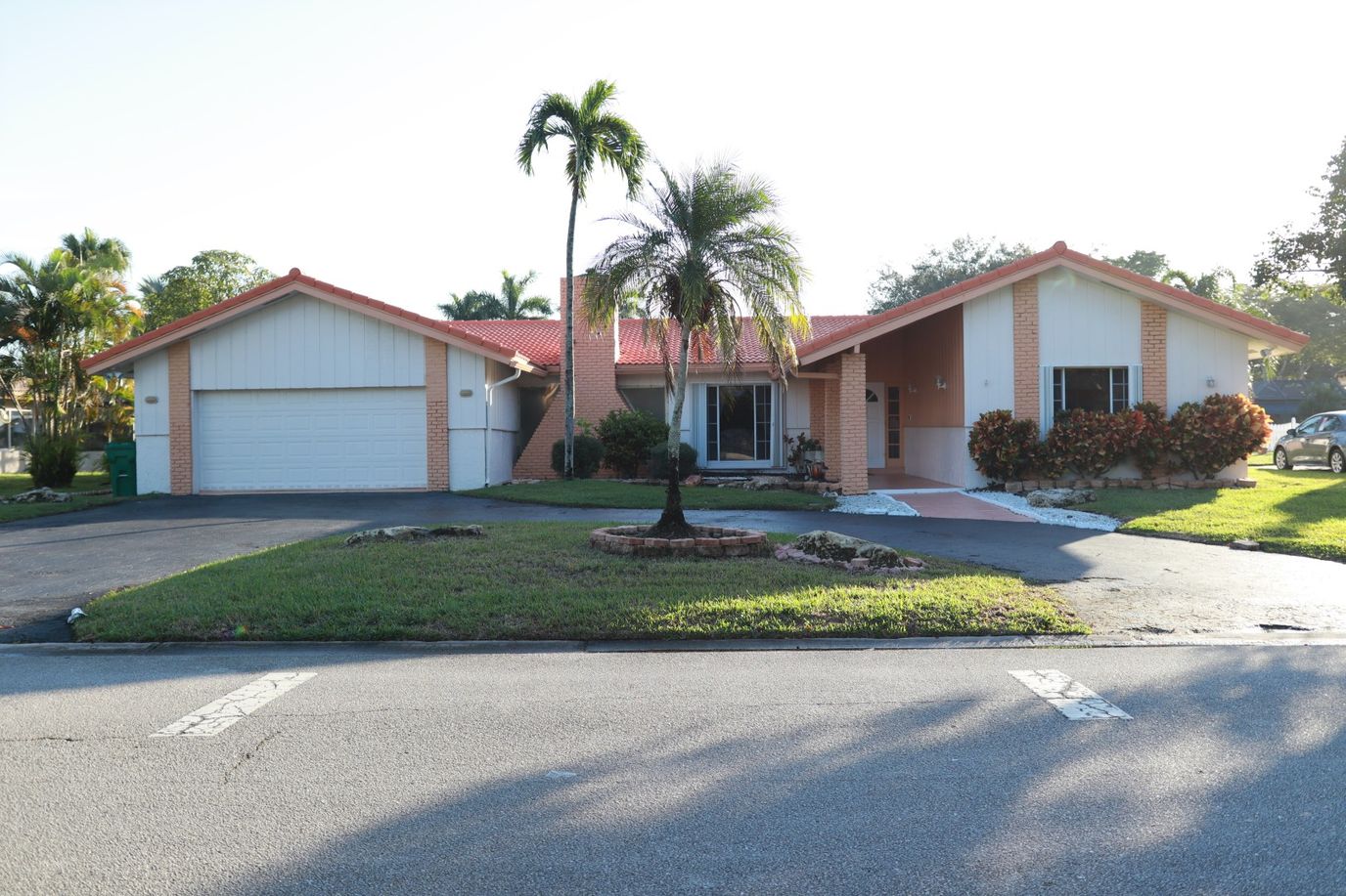 Exterior view of a single-family home with garden