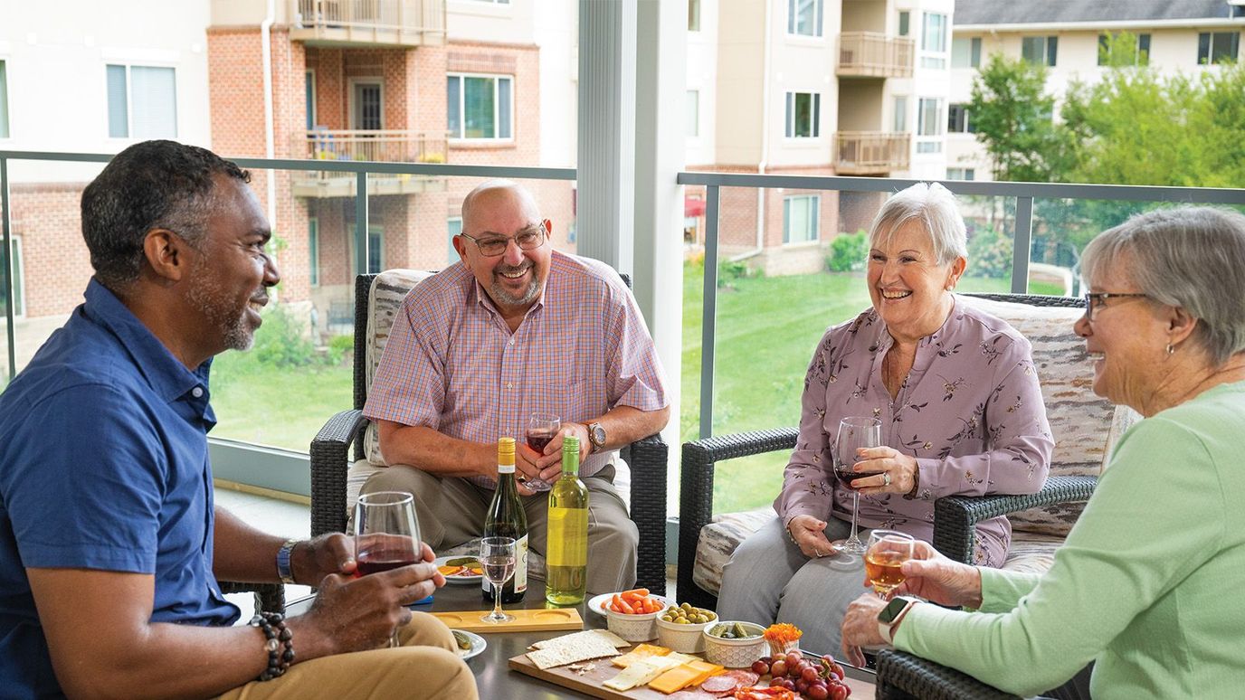 Residents enjoying a social gathering with food and drinks