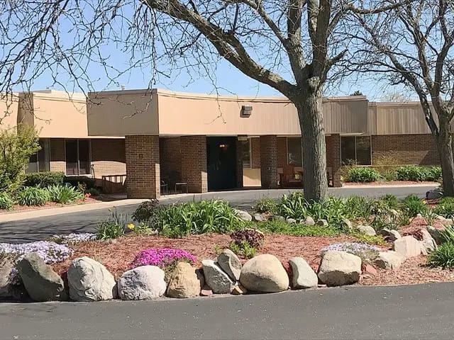 Exterior view of Medilodge of Mt Pleasant with landscaped garden.