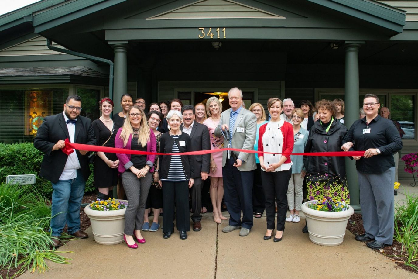 Group photo at a ribbon-cutting ceremony