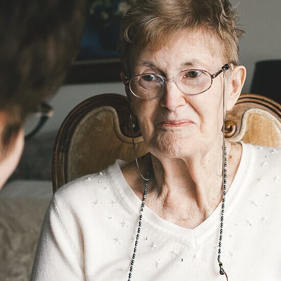 Home Helpers Home Care of Davenport, home care in Davenport, IA — Elderly woman wearing glasses sitting in a chair