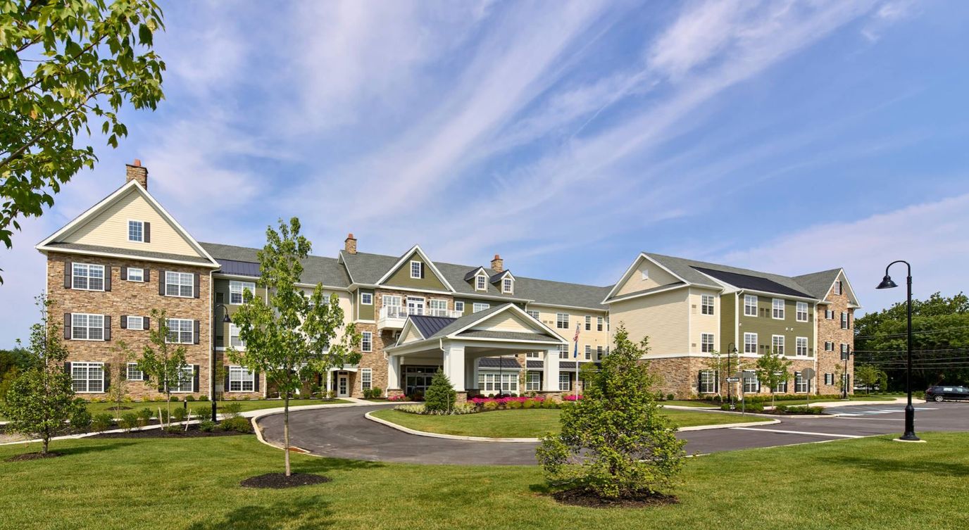 Exterior view of Arbor Terrace Exton facility with landscaped grounds