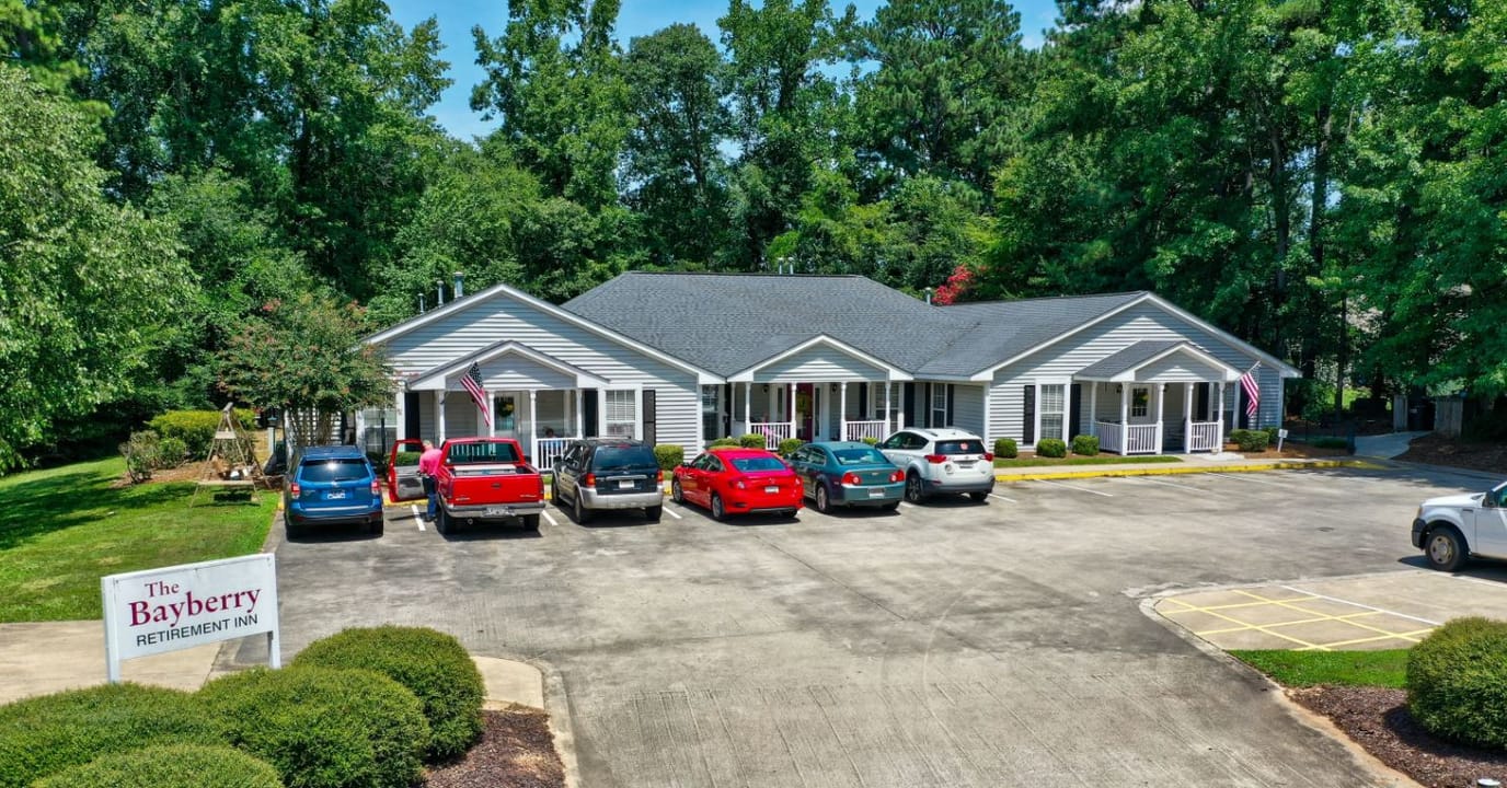 Exterior view of Bayberry Retirement Inn with parking