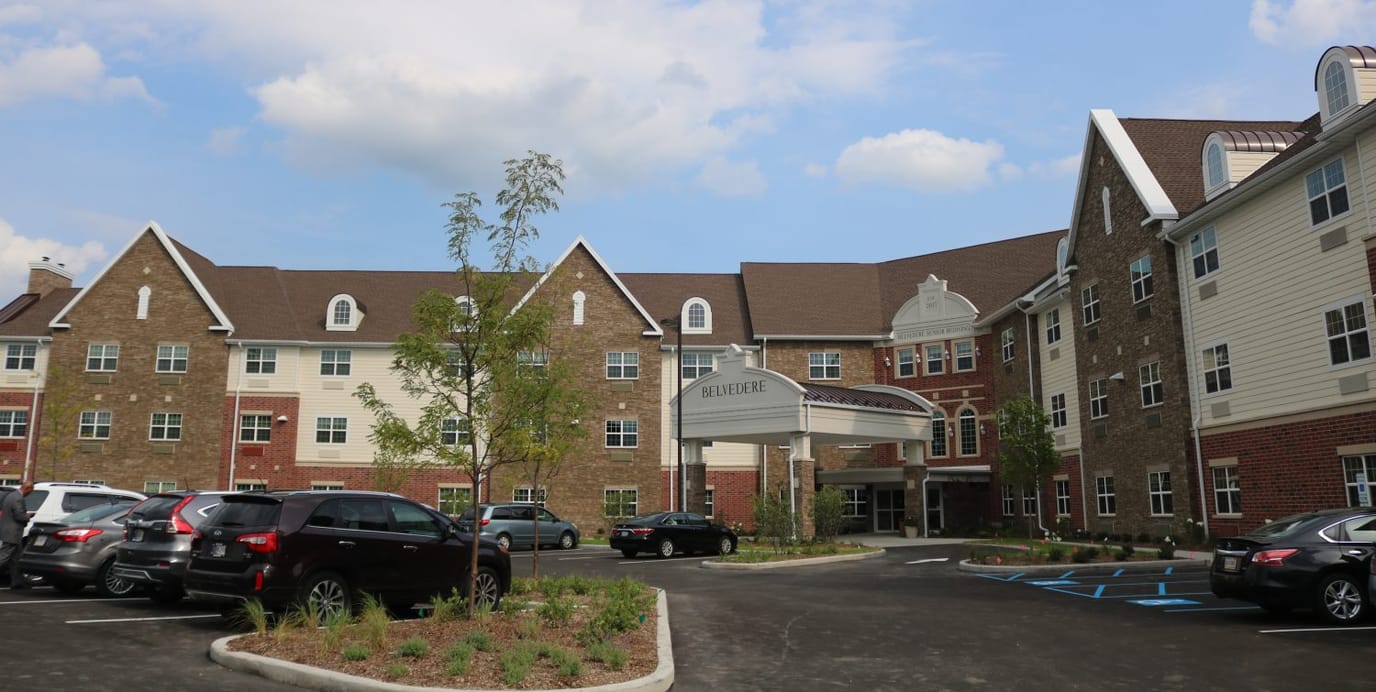 Exterior view of Belvedere Senior Housing entrance and parking area