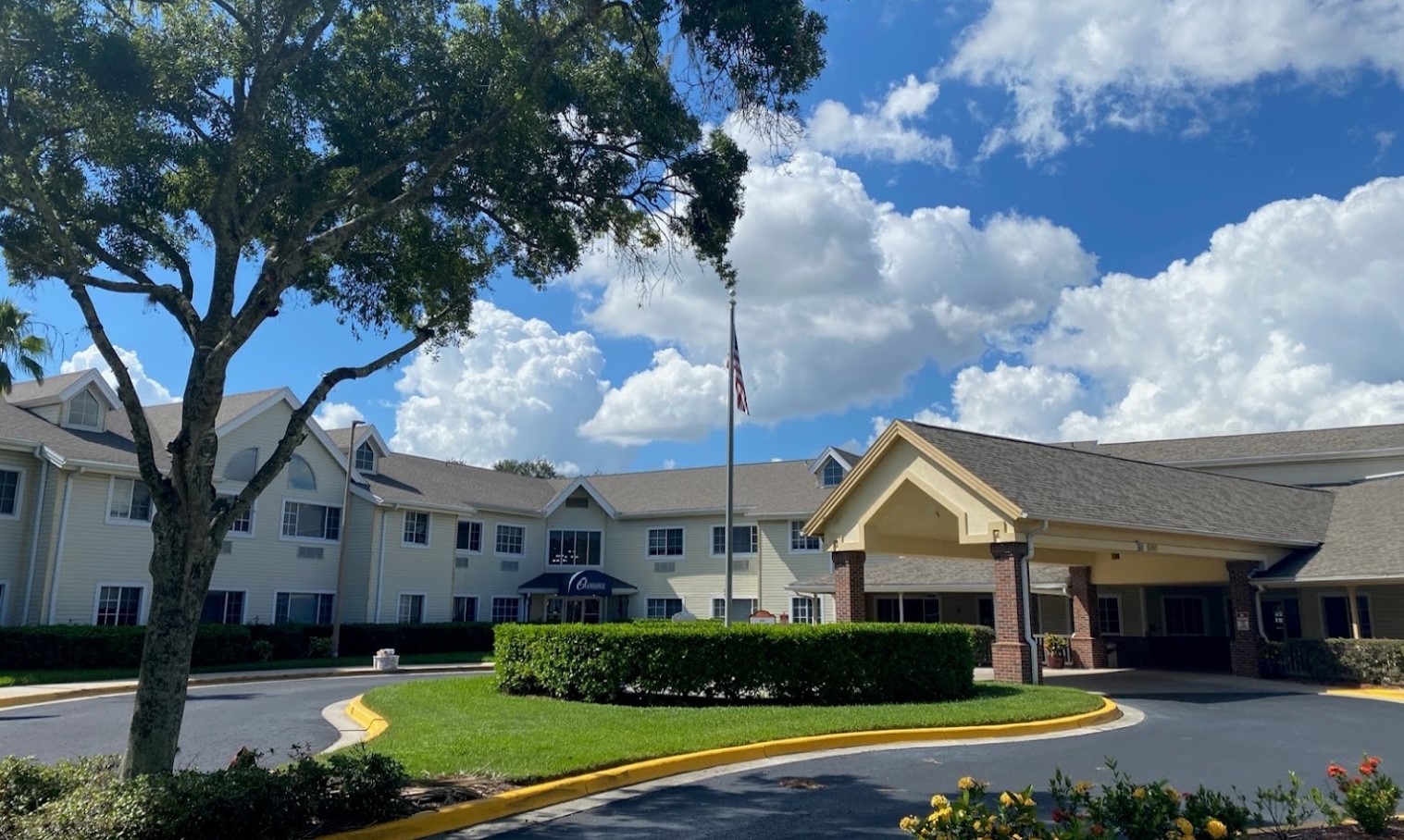 Exterior view of a senior living facility with landscaped grounds