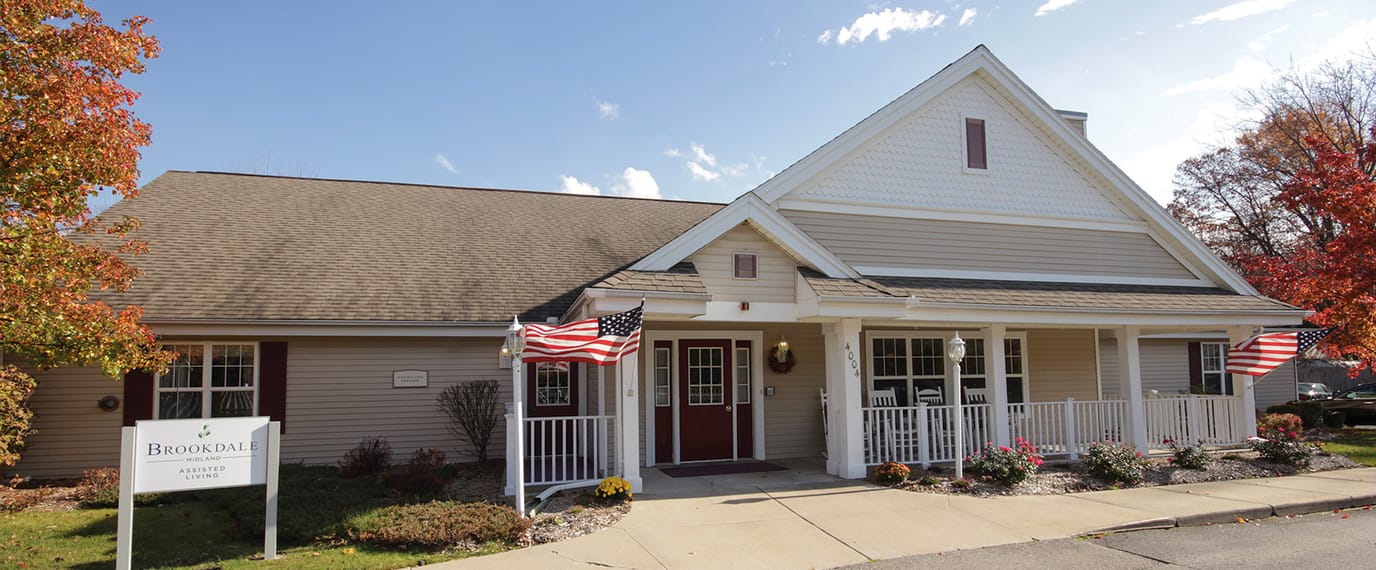 Exterior view of Brookdale Midland with fall decorations