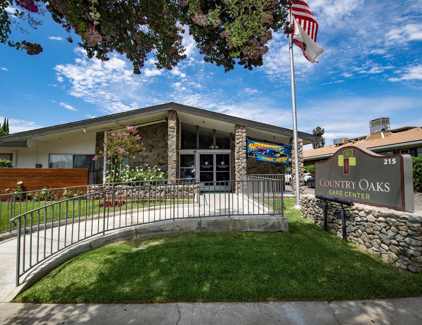 Exterior view of Country Oaks Care Center with signage