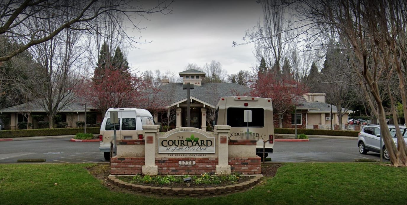 Exterior view of The Courtyard with facility signage