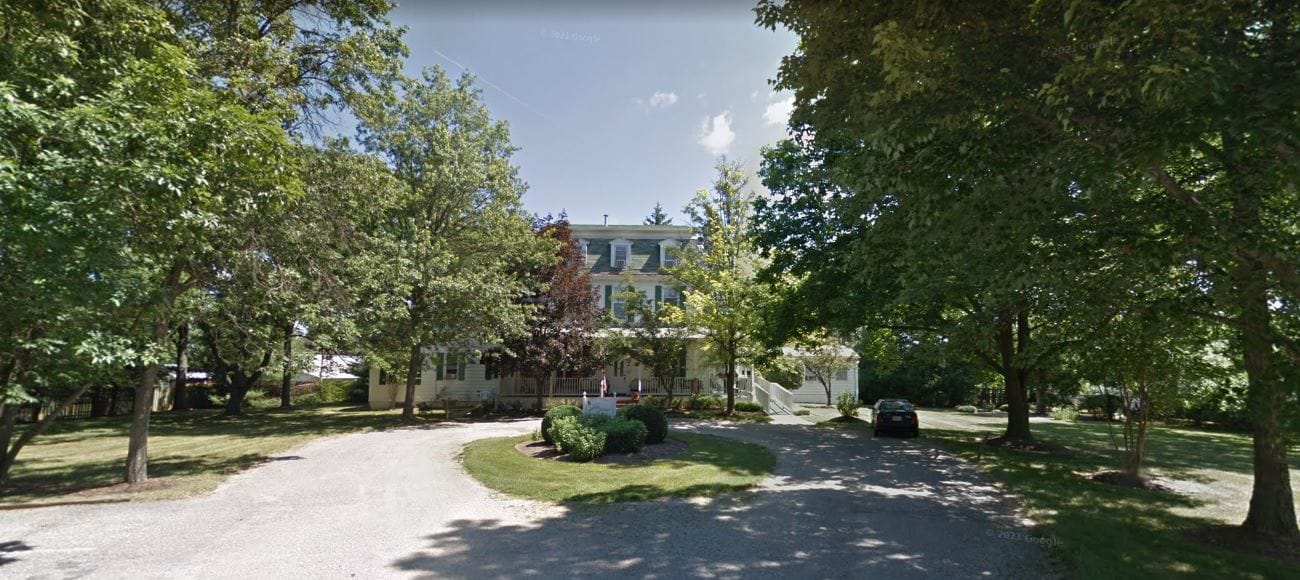View of the assisted living facility surrounded by trees