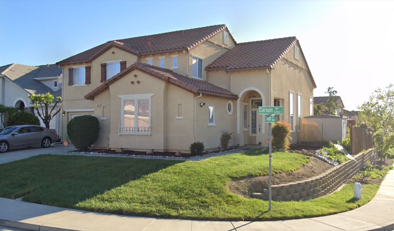 Exterior view of a residential home with landscaping