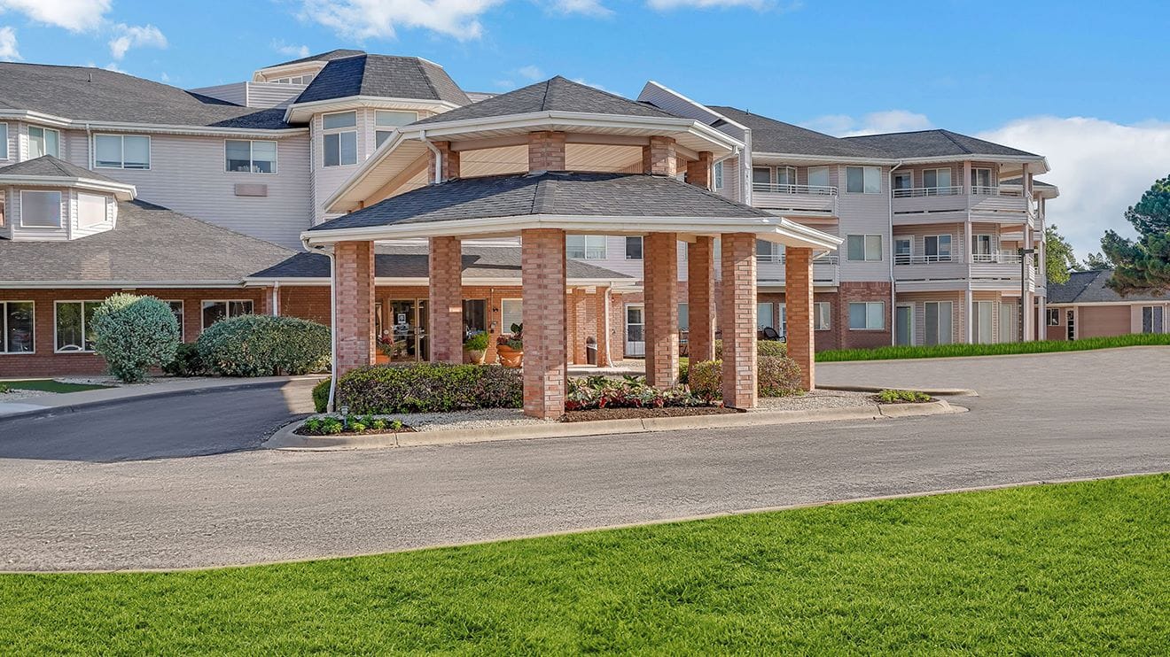 Exterior view of Polo Park Estates with landscaped entrance