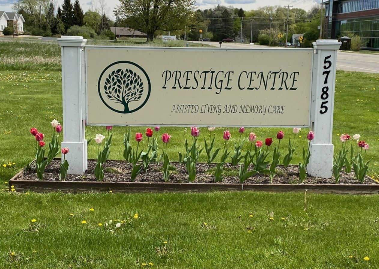 Facility sign with flowers in the foreground