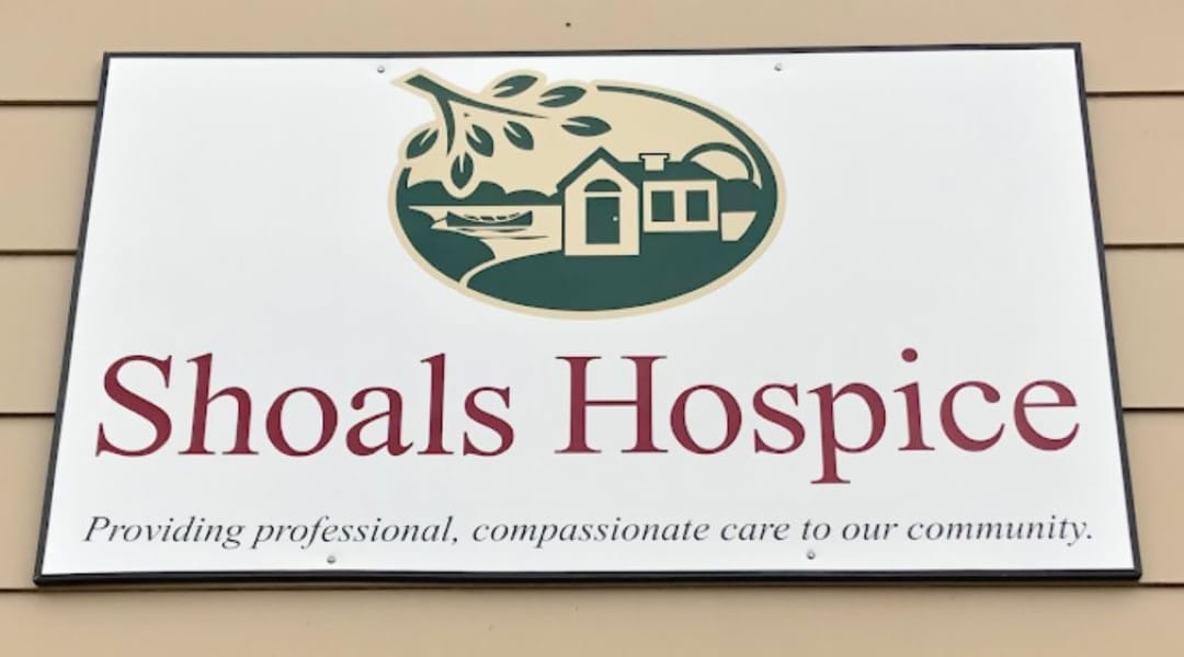 Sign for Shoals Hospice indicating professional and compassionate care