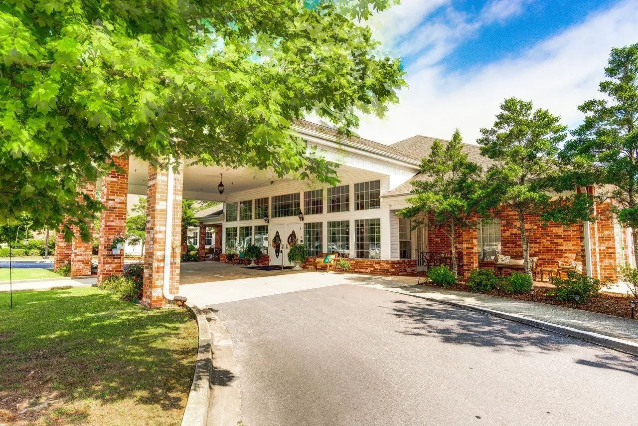 Exterior view of a senior living facility with landscaping