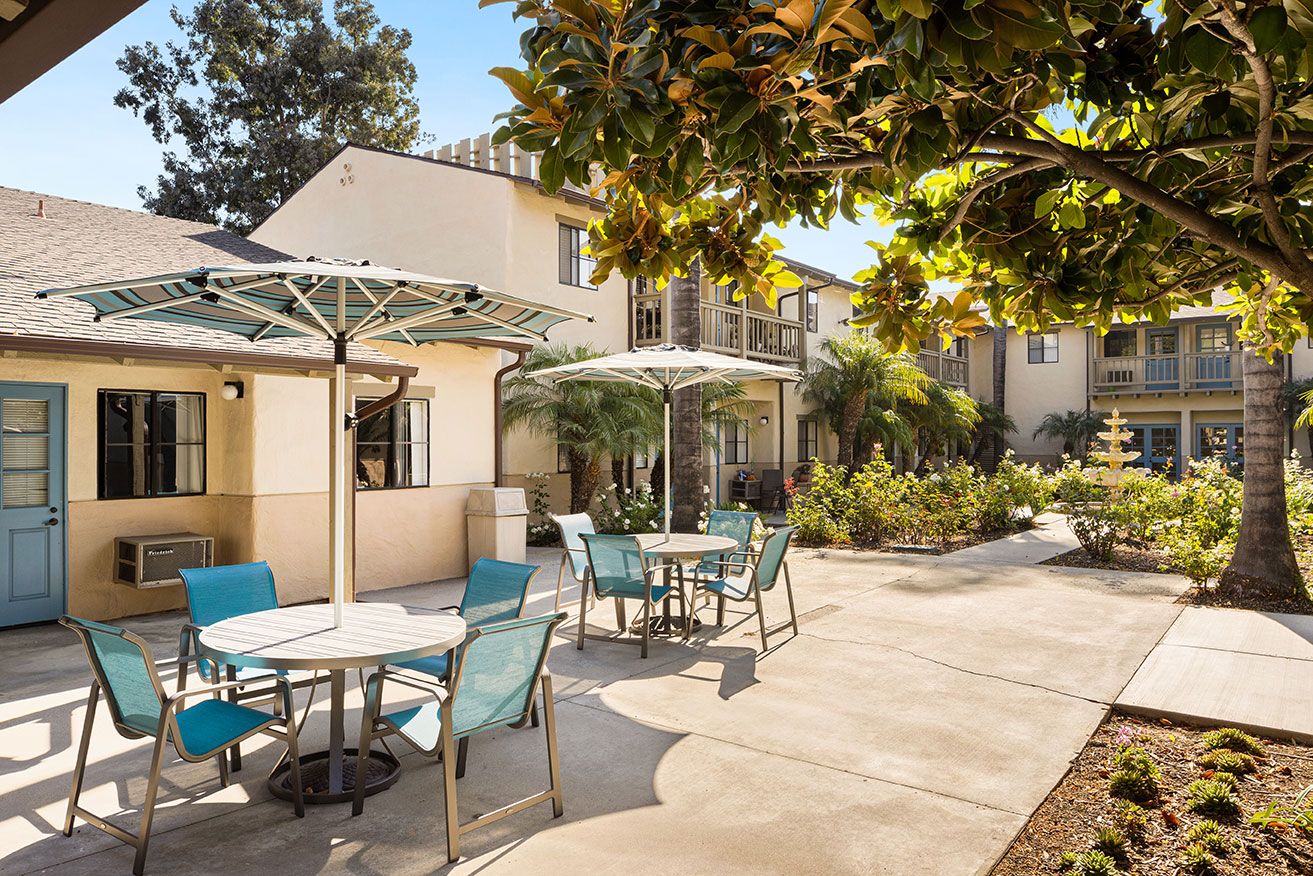 Outdoor patio area with seating and umbrellas