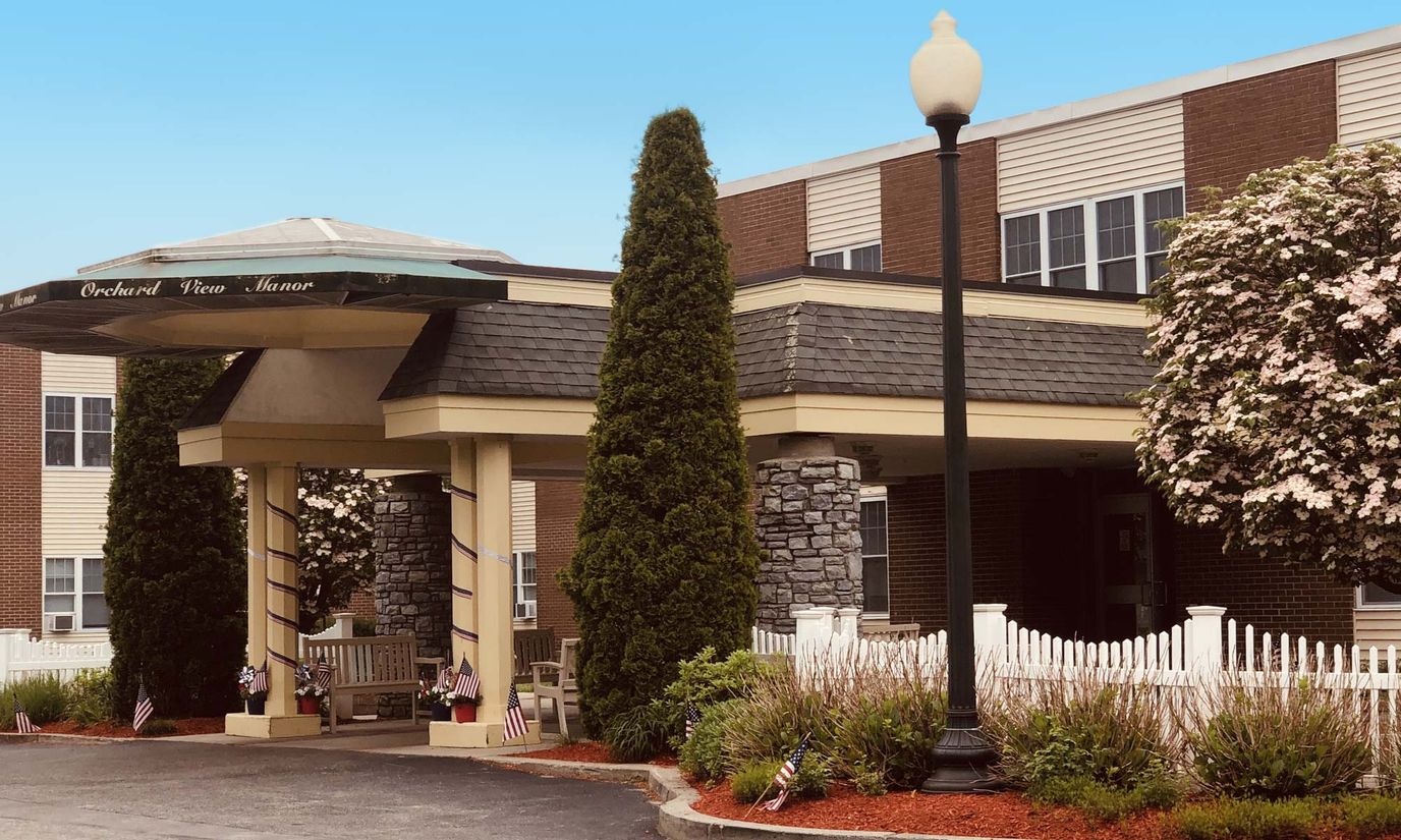 Front entrance of Orchard View Manor with landscaping