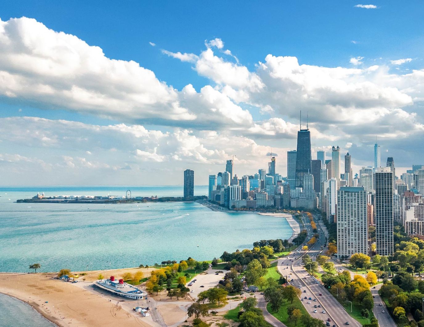 Aerial view of a city with waterfront and skyline.