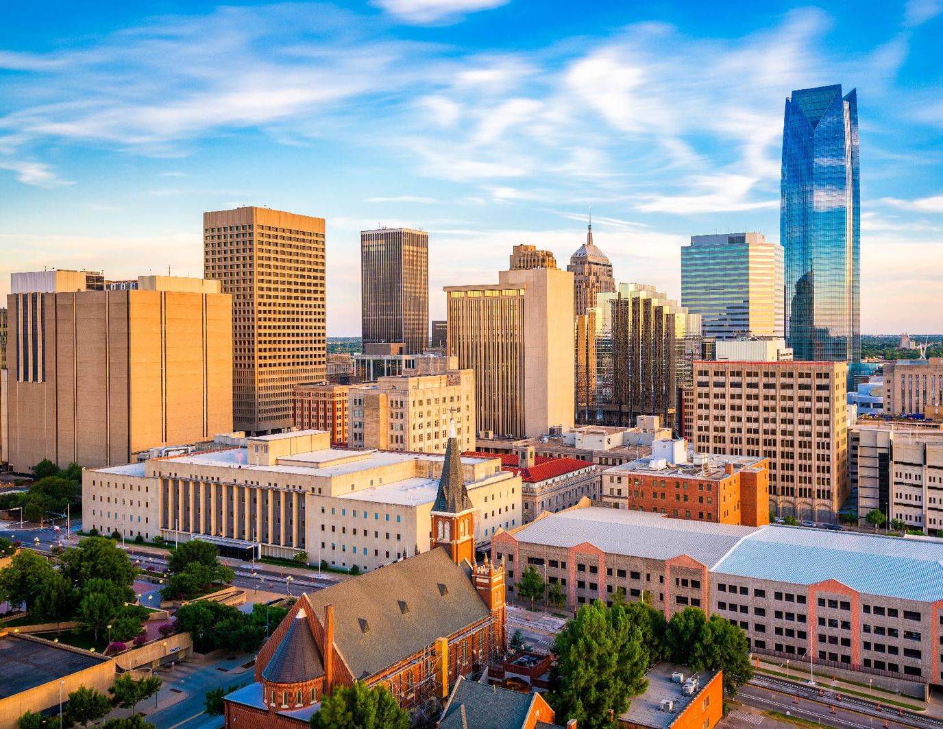 City skyline with modern and historic buildings.