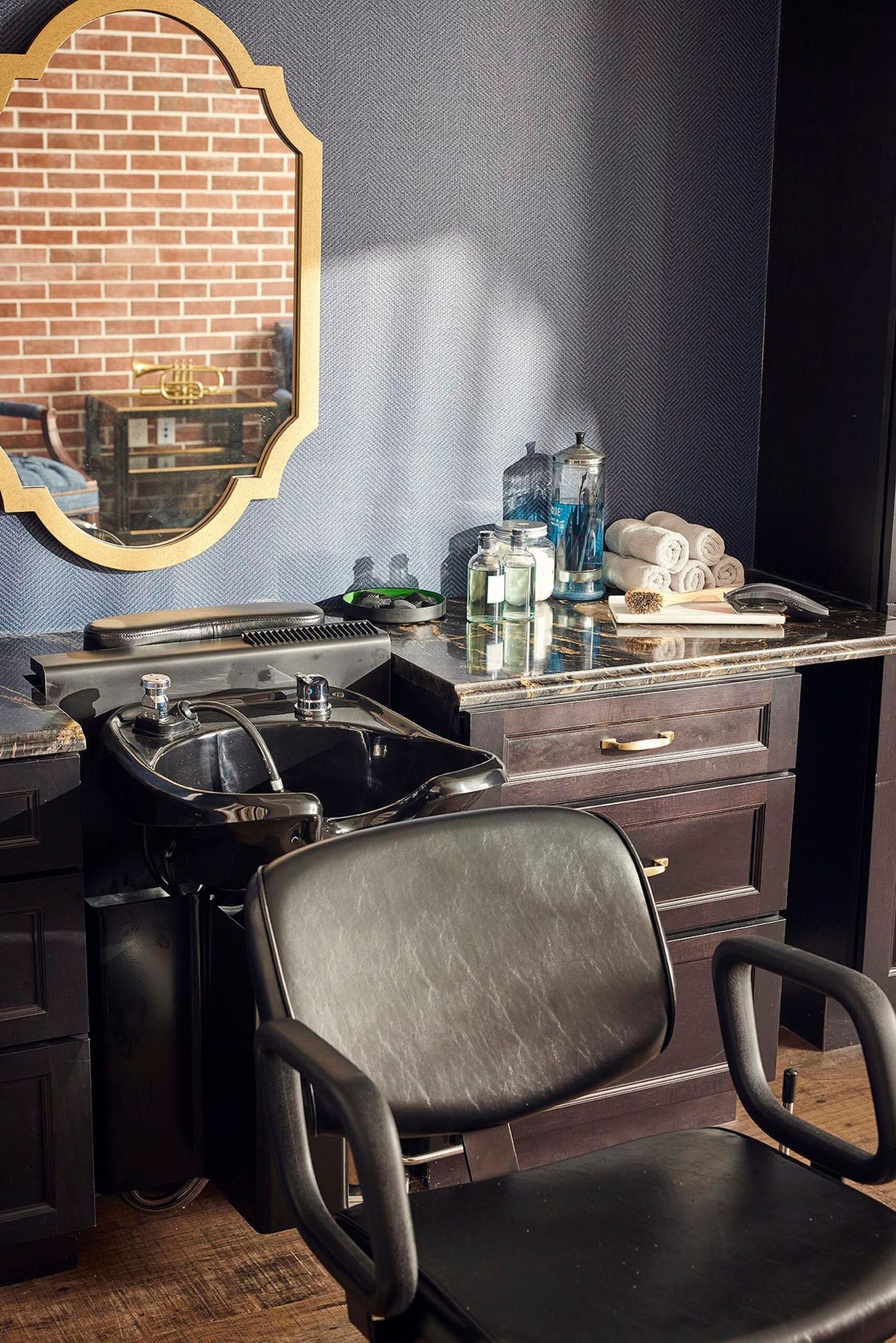Interior view of a salon station with supplies