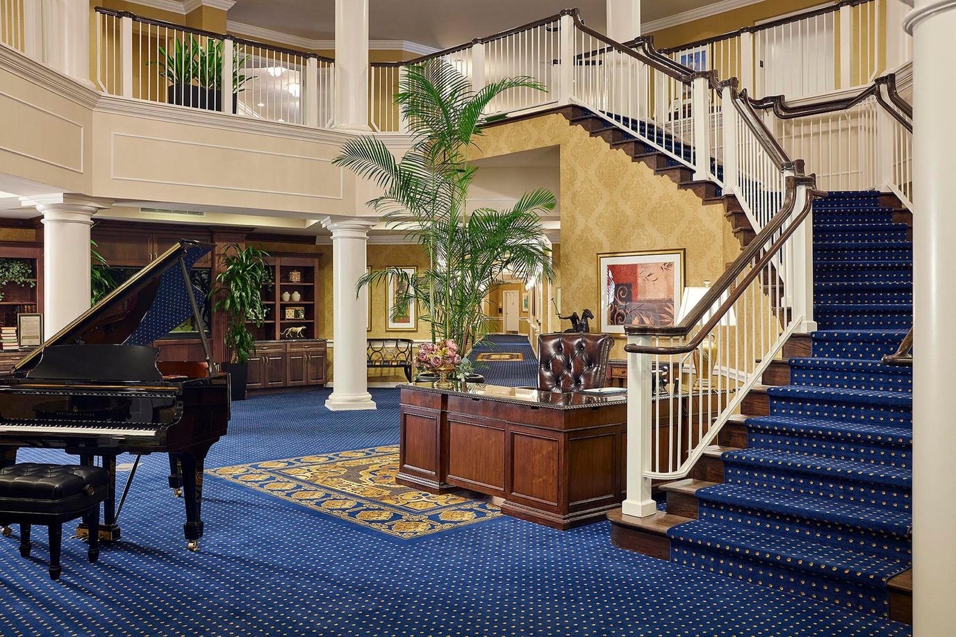 Elegant interior lobby with a staircase and piano