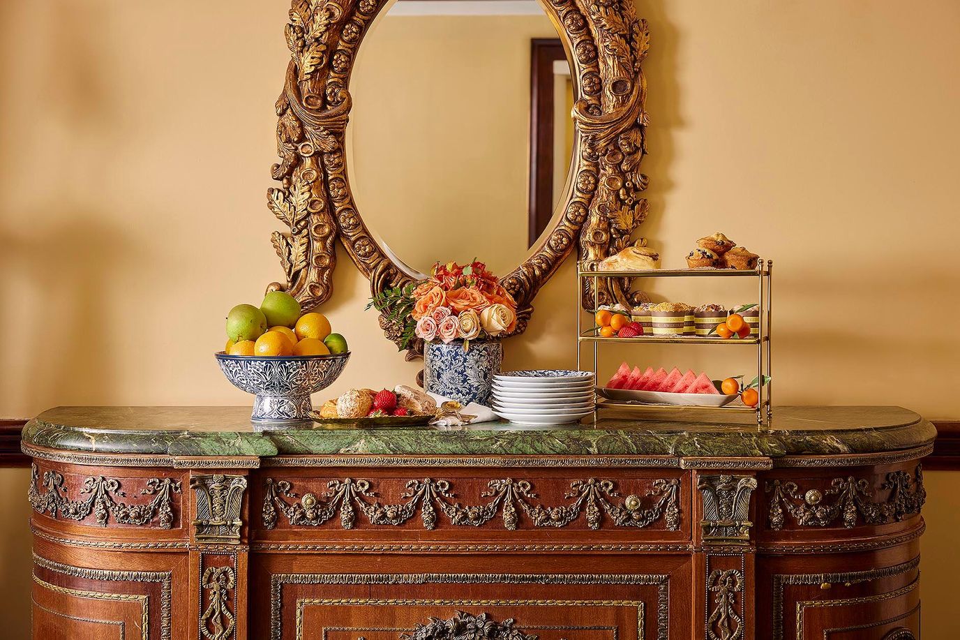 A beautifully arranged dining area with fruit and pastries