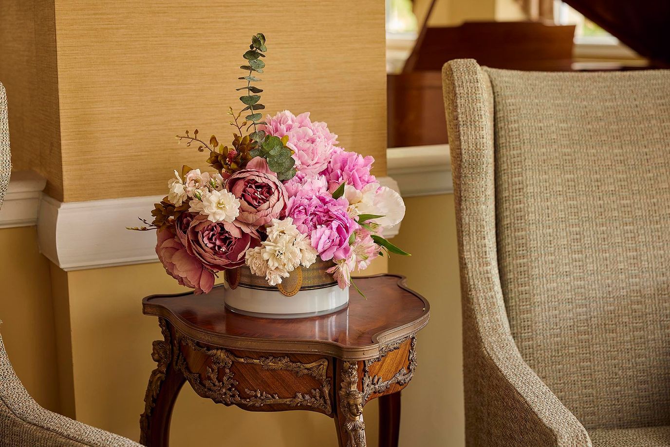 Floral arrangement on a side table in a common area