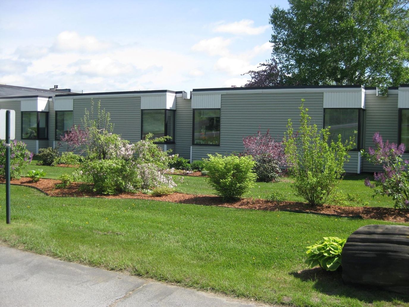 Well-maintained garden area in front of the facility