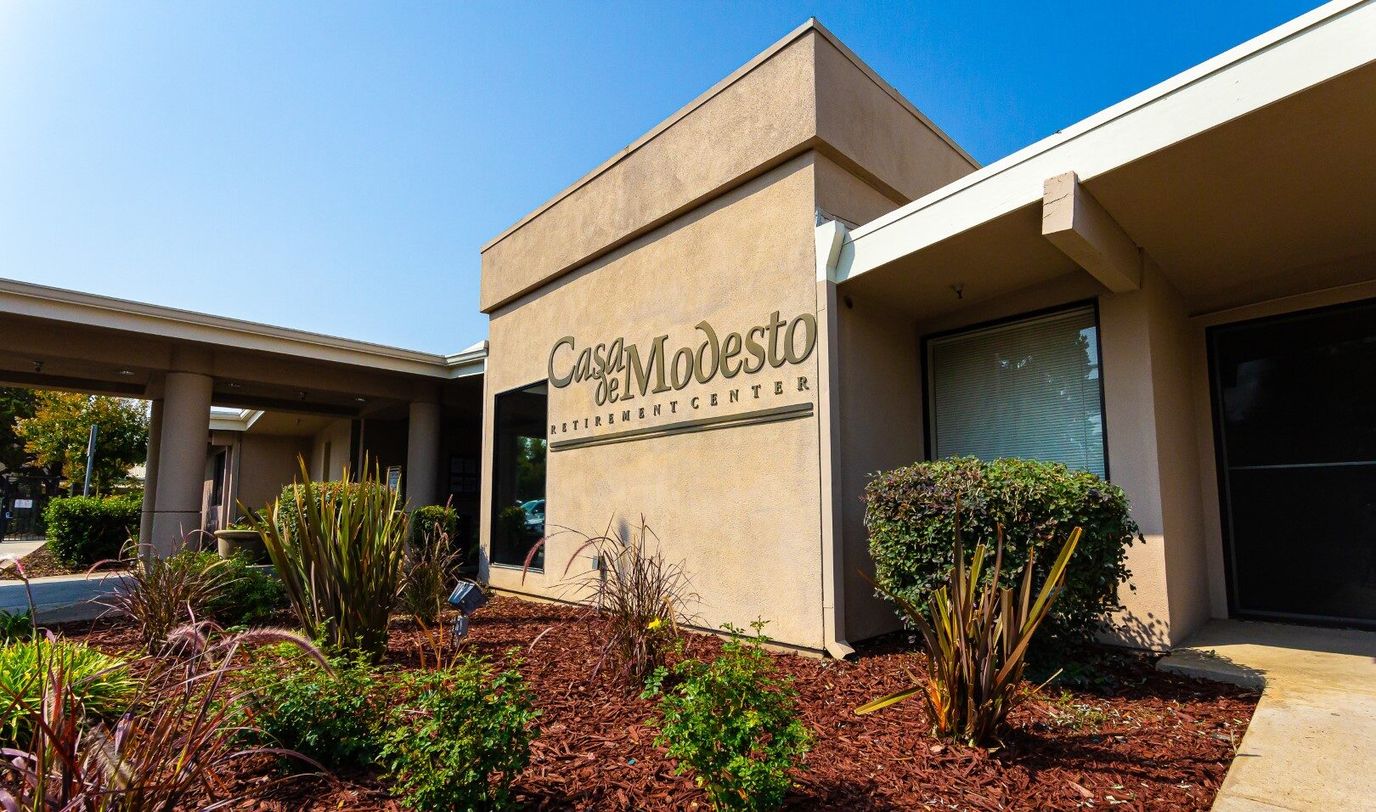 Exterior view of Casa De Modesto with landscaped entrance