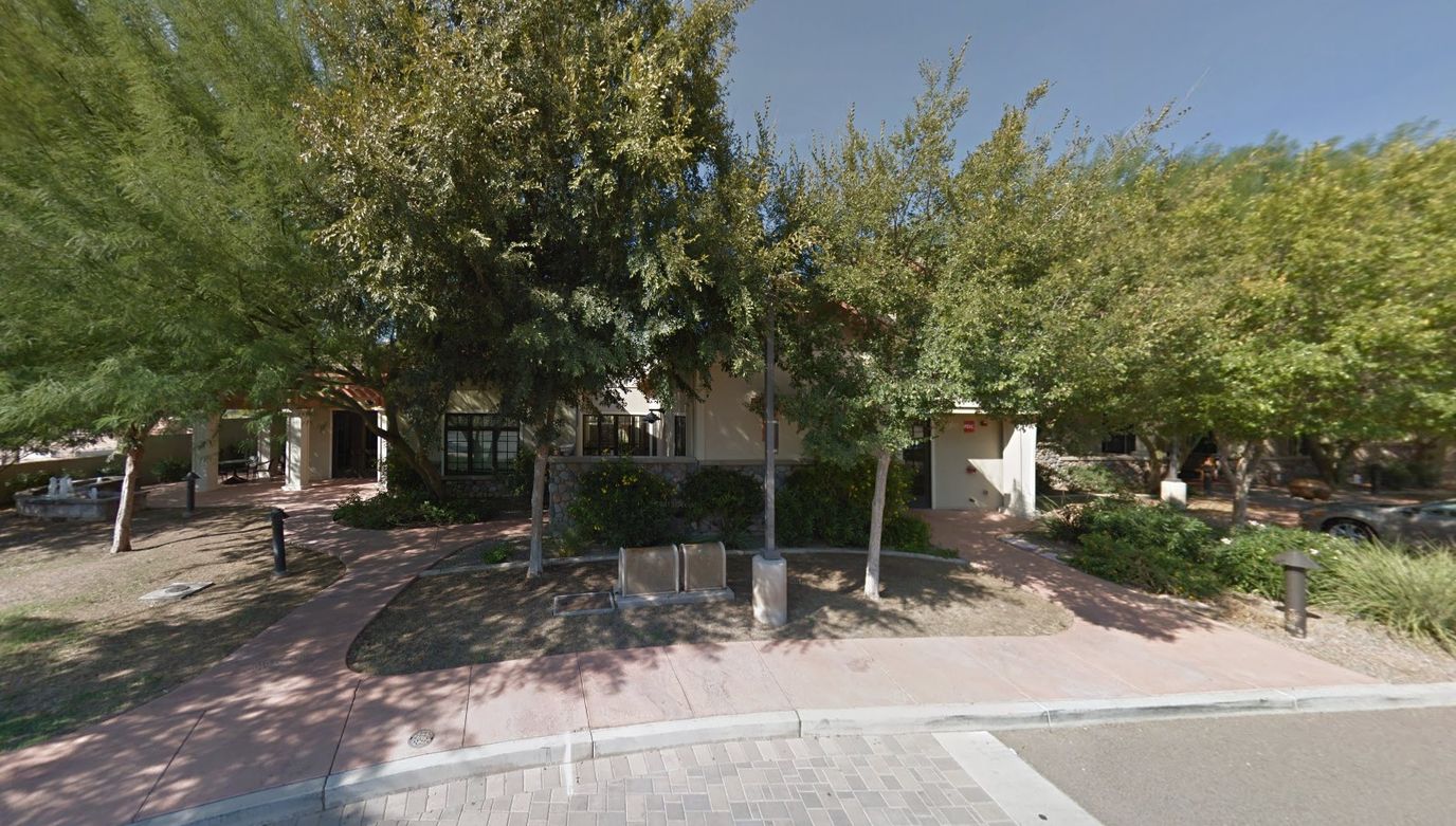 Exterior view of the Lund Home surrounded by trees