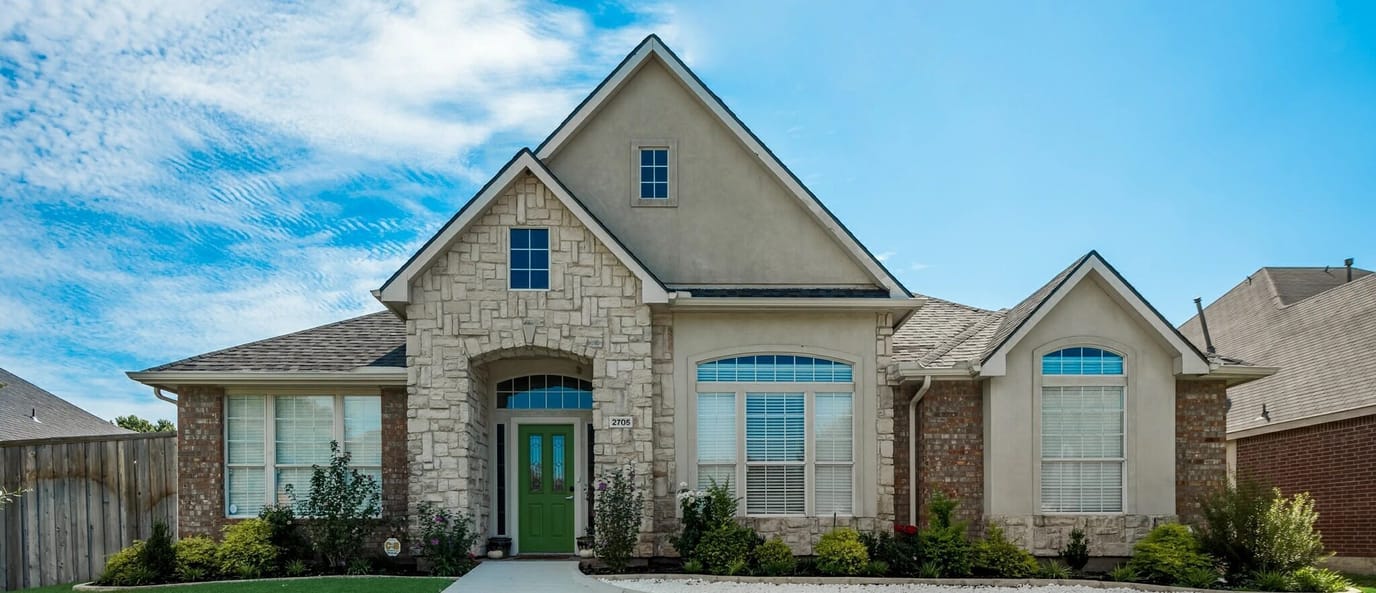 Exterior view of a residential facility with blue sky