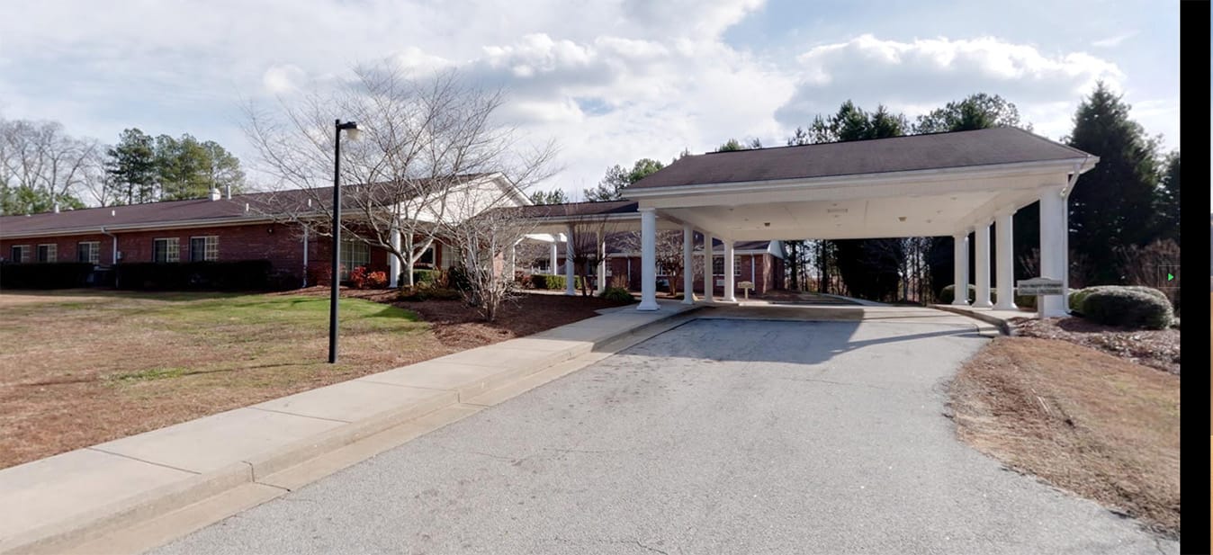 Exterior view of the facility entrance and drive-up area