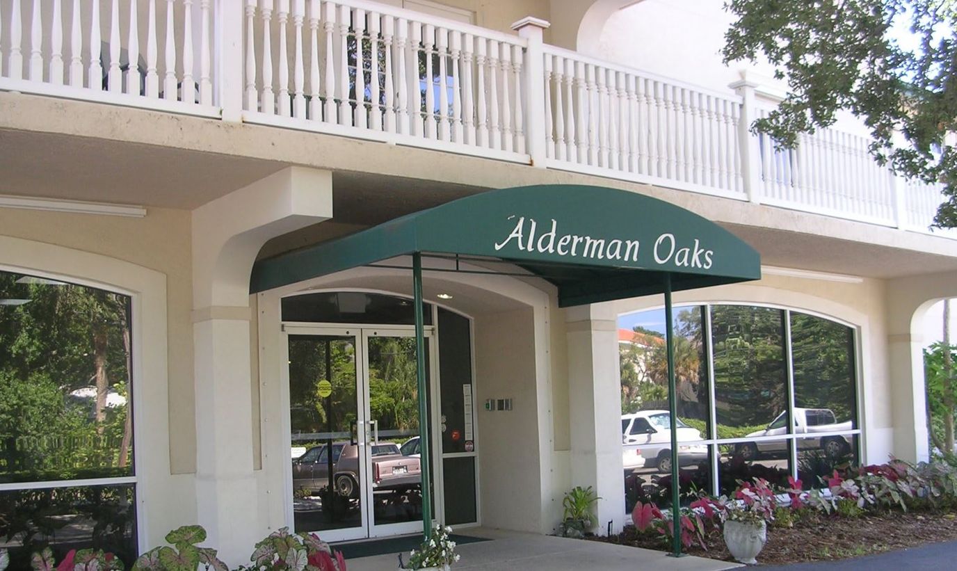 Entrance of Alderman Oaks facility with landscaping