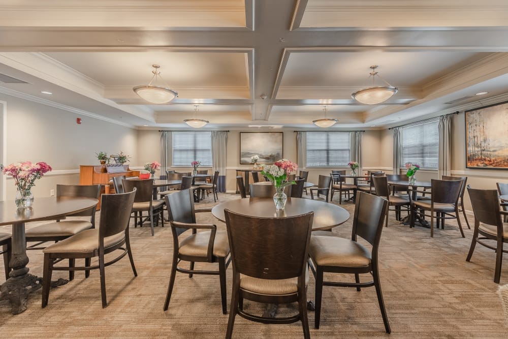 Bright dining room with tables and floral decorations