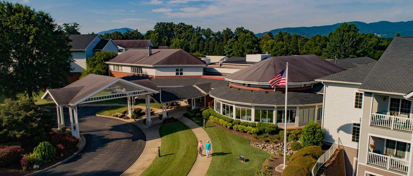 Aerial view of a senior living facility with outdoor paths