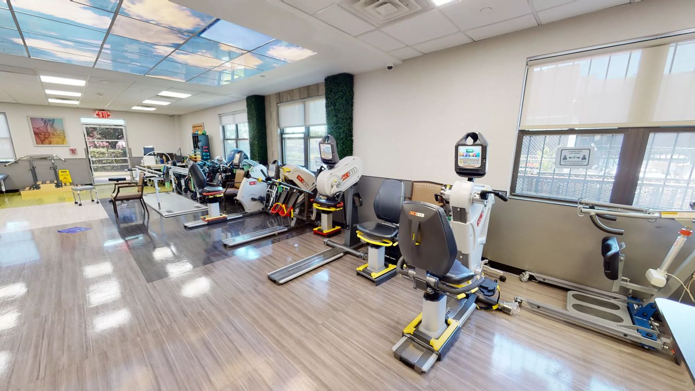 Rehabilitation gym area with specialized equipment