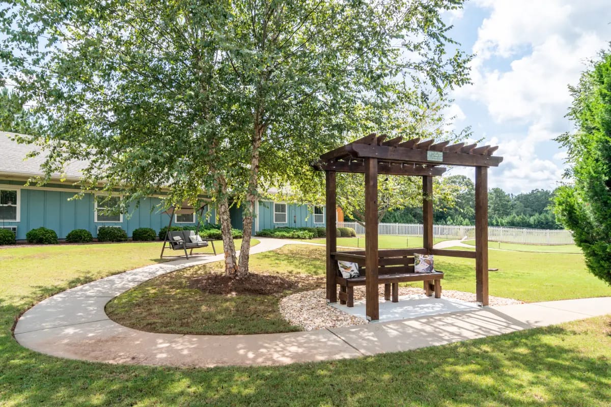 Outdoor seating area surrounded by greenery