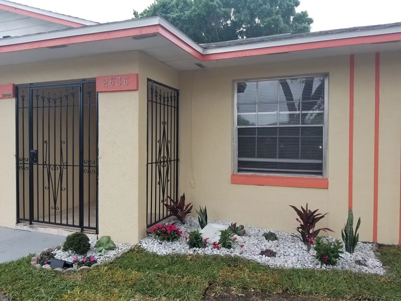 Exterior view of a building entrance with landscaping