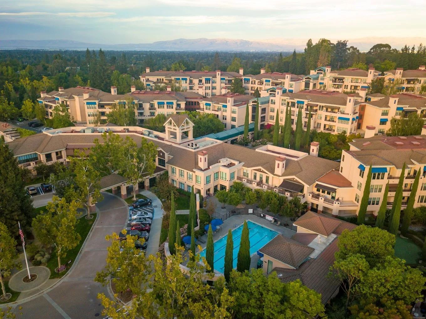 Aerial view of the facility with pool and gardens