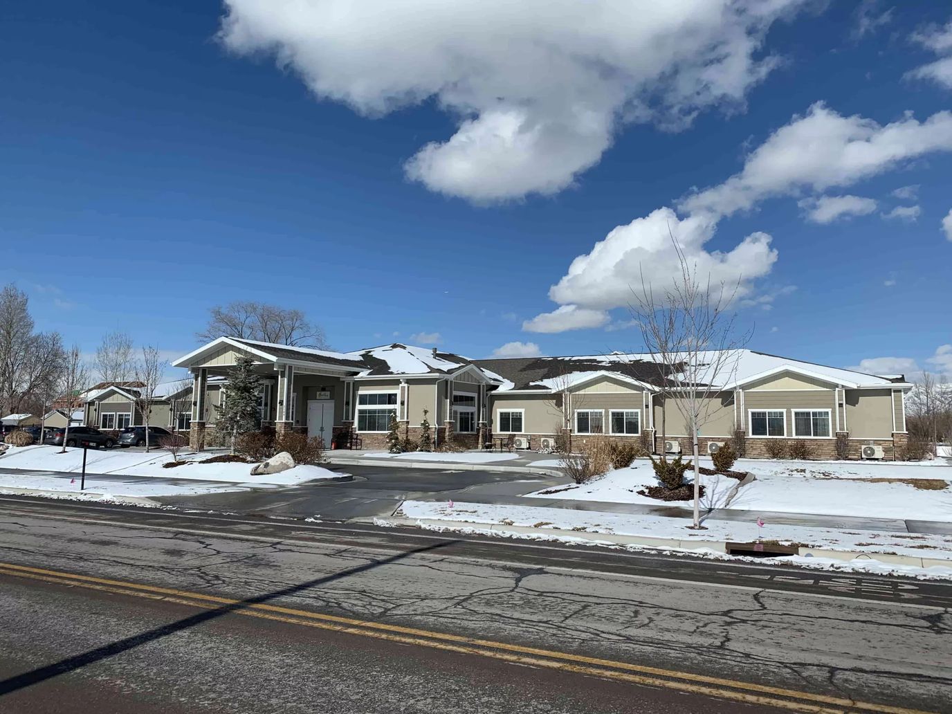 Exterior view of BeeHive Homes of Provo with snow