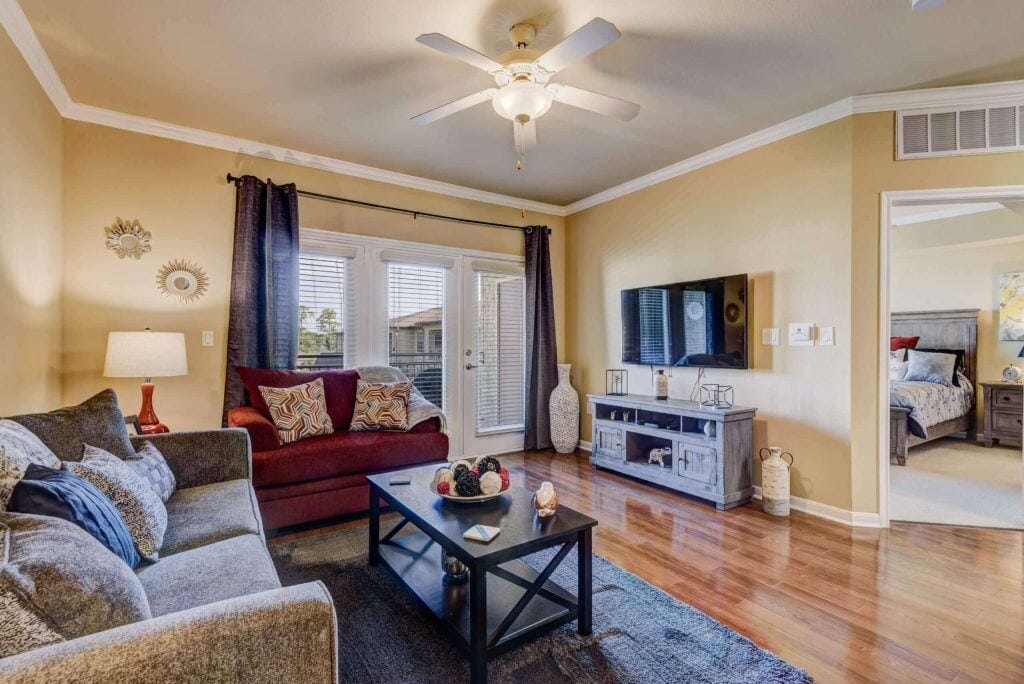 Conservatory at Champion Forest, independent living in Spring, TX — Cozy living room with modern furnishings and decor