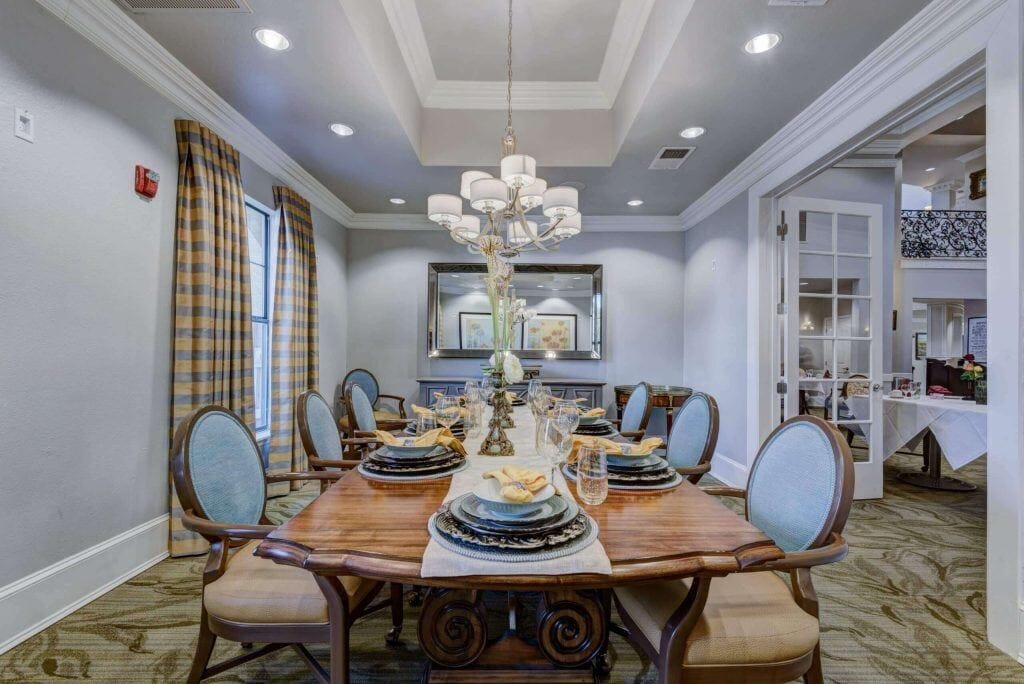 Conservatory at Champion Forest, independent living in Spring, TX — Elegant dining room set for a formal meal