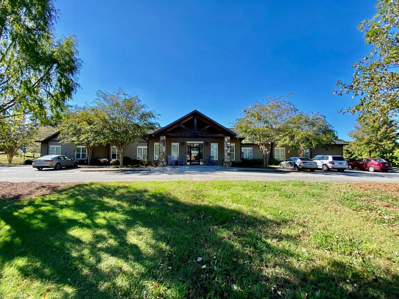 Exterior view of Heritage Hospice facility with a clear sky