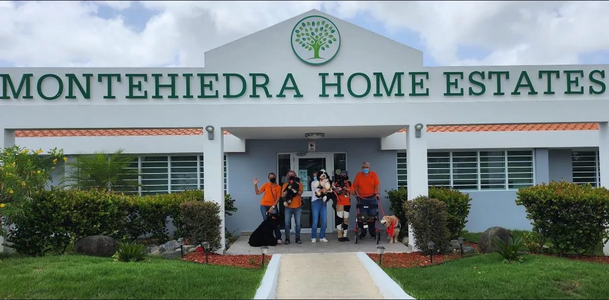 Entrance of Montehiedra Home Estates with staff and residents