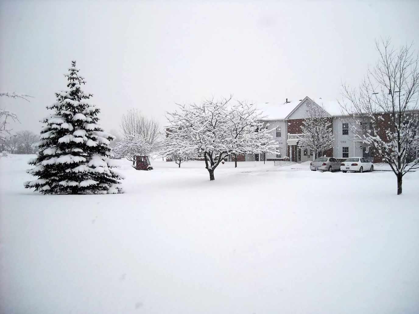 Exterior view of a senior living facility covered in snow
