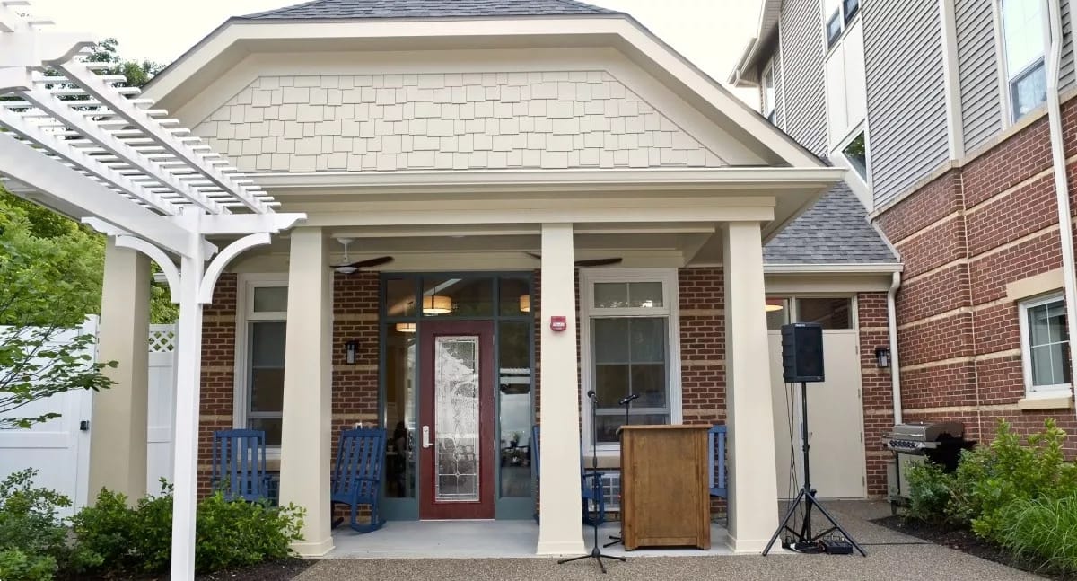 Entrance of a senior living facility with seating area