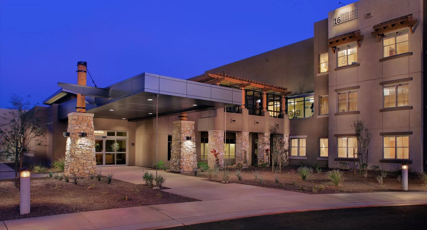 Exterior of Acacia Health Center at dusk