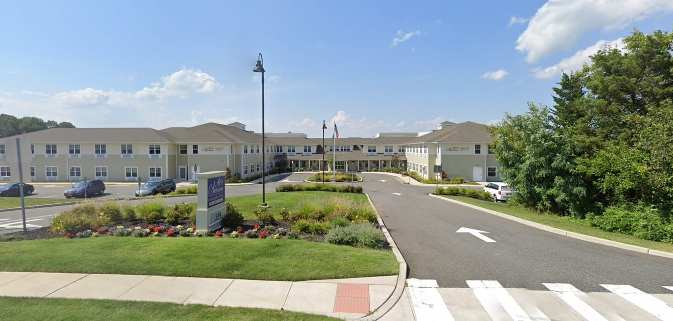 Front view of All American Assisted Living building and landscaping